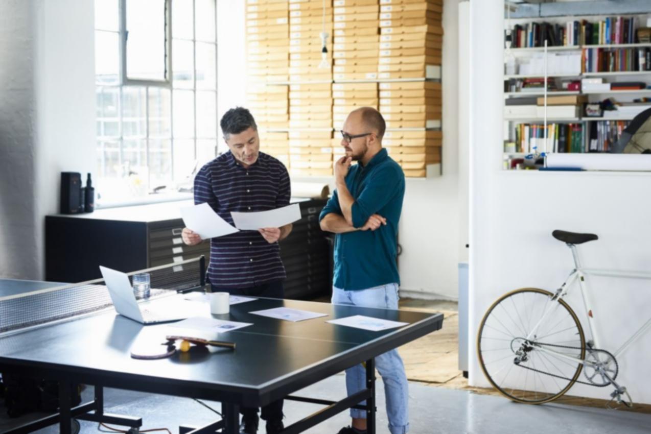 Team members collaborating on project with digital tools